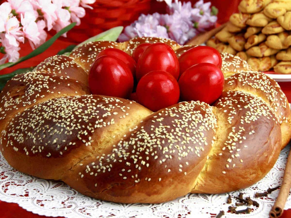 Easter Traditions in Greece Red Easter eggs in a tsoureki