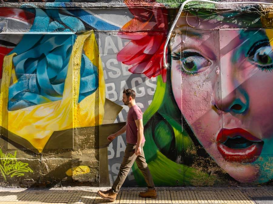 Traveler enjoying a guided tour of street art