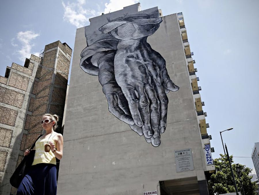 Photo source: Greek Reporter ‘Praying for us’ mural by Anastasakos and Cretsis brothers