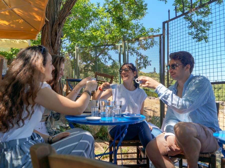 Sharing local drinks in Athens